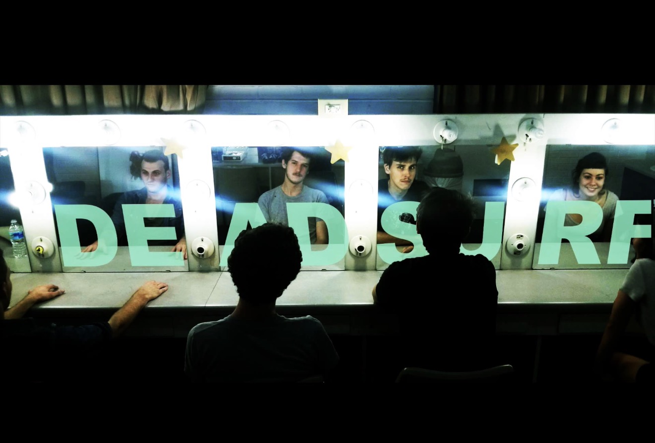 Dead Surf band members reflected in illuminated dressing-room mirrors