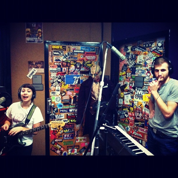 Kelsey Lopez de Victoria with guitar and Randy Bryan Moore at a keyboard in a radio studio during the Dead Surf years
