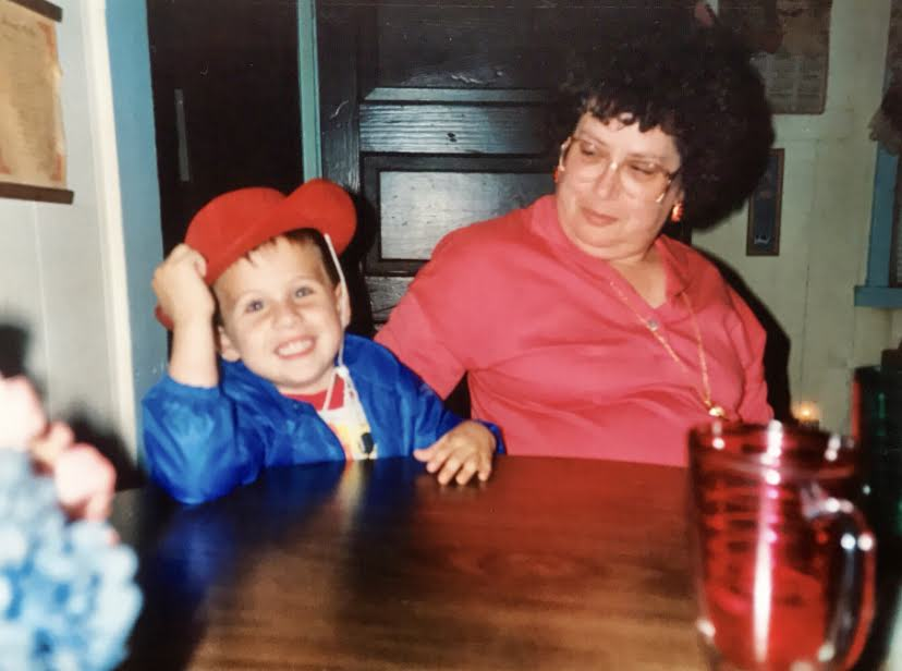 Young Randy sitting with Granny Rita